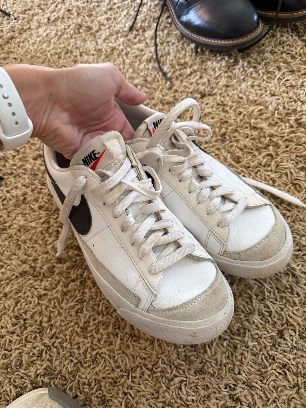 Nike White Low-Top Sneakers with Black Swoosh and Cream Accents